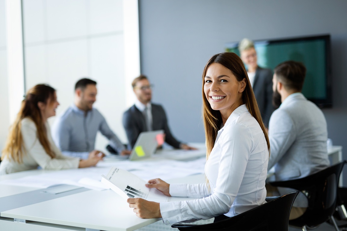 Group of business people collaborating on project in office